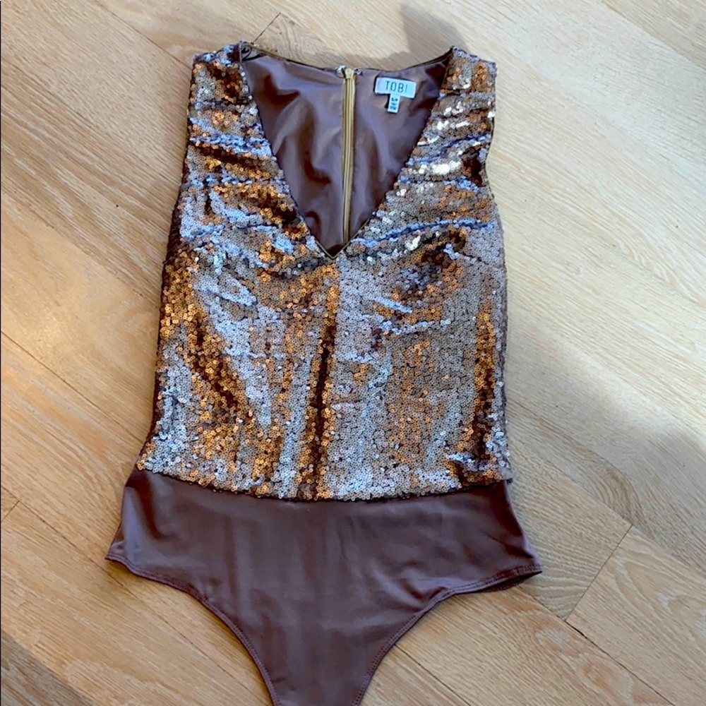 Gold sparkly body suit